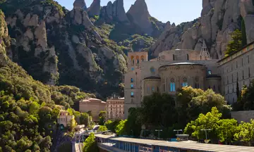 The unmistakable silhouette of Montserrat, a legendary mountain range steeped in myths and spirituality.